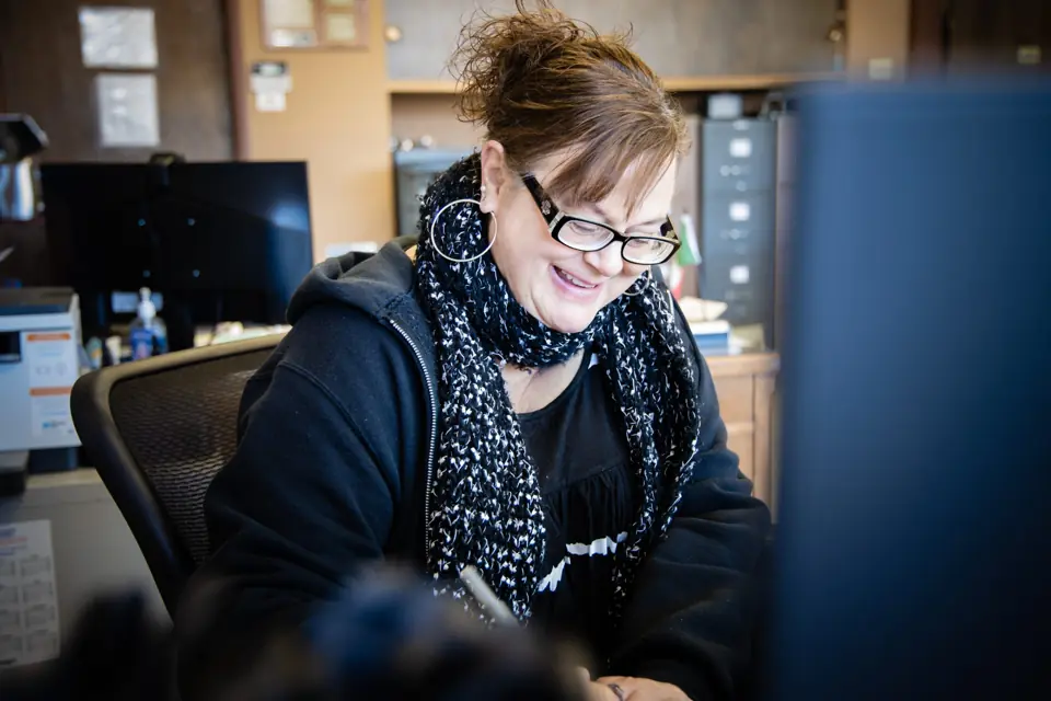 An O'Brien's office team member working at a computer