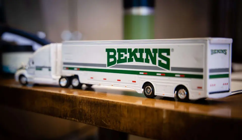 A model Bekins tractor-trailer on an office desk