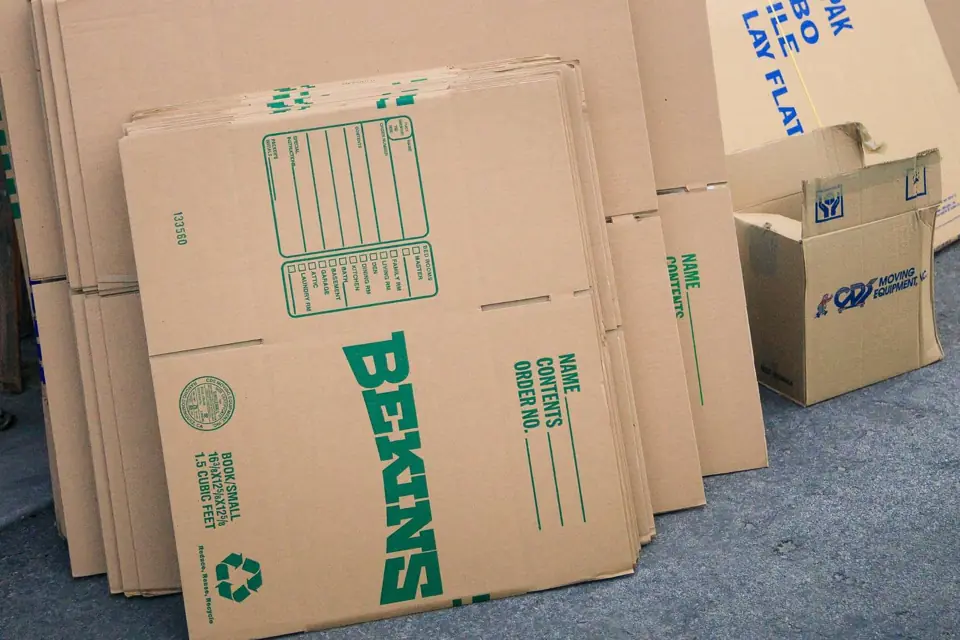 Flat Bekins moving cartons stacked and ready for packing