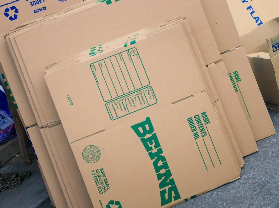 Flat Bekins moving cartons stacked and ready for packing