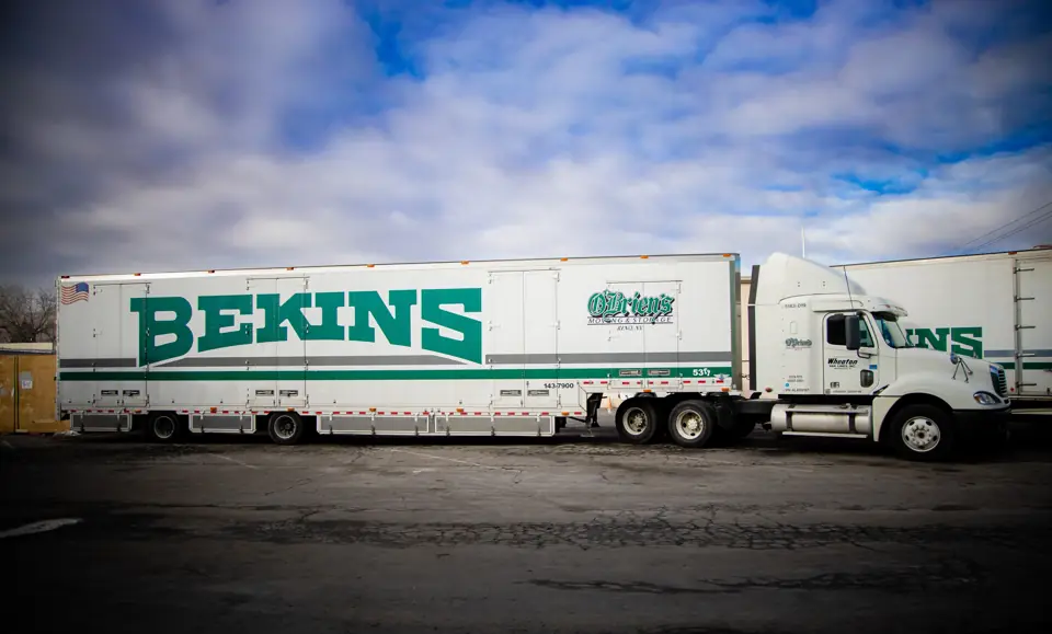 A Bekins tractor-trailer parked in the O'Brien's yard in Sparks under a big sky