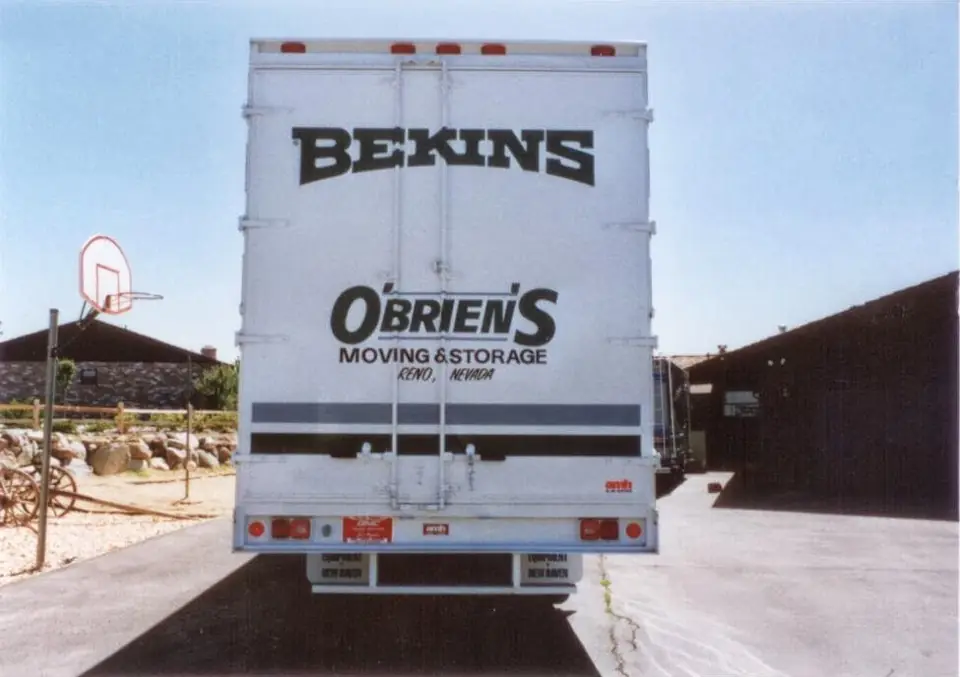 The rear doors of an older O'Brien's Moving & Storage truck in Bekins livery