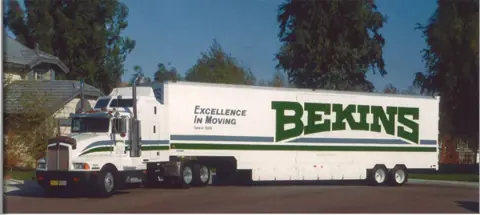 A Bekins tractor-trailer lettered Excellence in Moving
