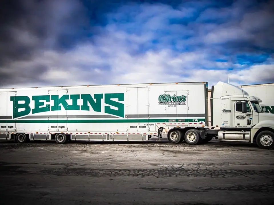 A Bekins tractor-trailer in the O'Brien's yard