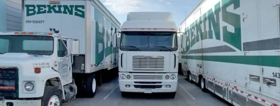 Three Bekins-liveried O'Brien's trucks parked nose-out in the Sparks yard