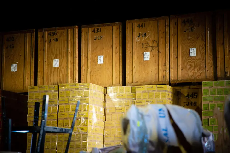 Wooden storage vaults and shrink-wrapped pallets inside the O'Brien's warehouse