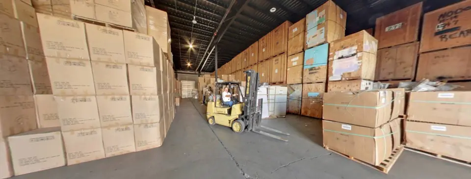 Rows of wooden storage vaults stacked high in the O'Brien's warehouse